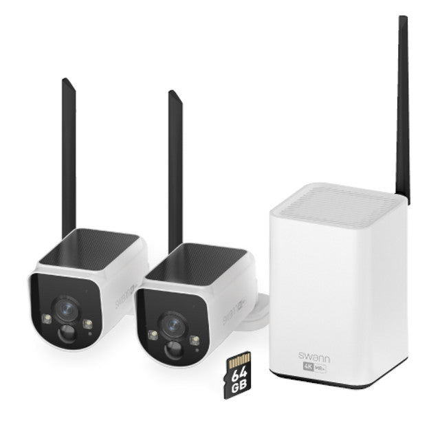 Two security cameras with antennas and a storage device on a white background