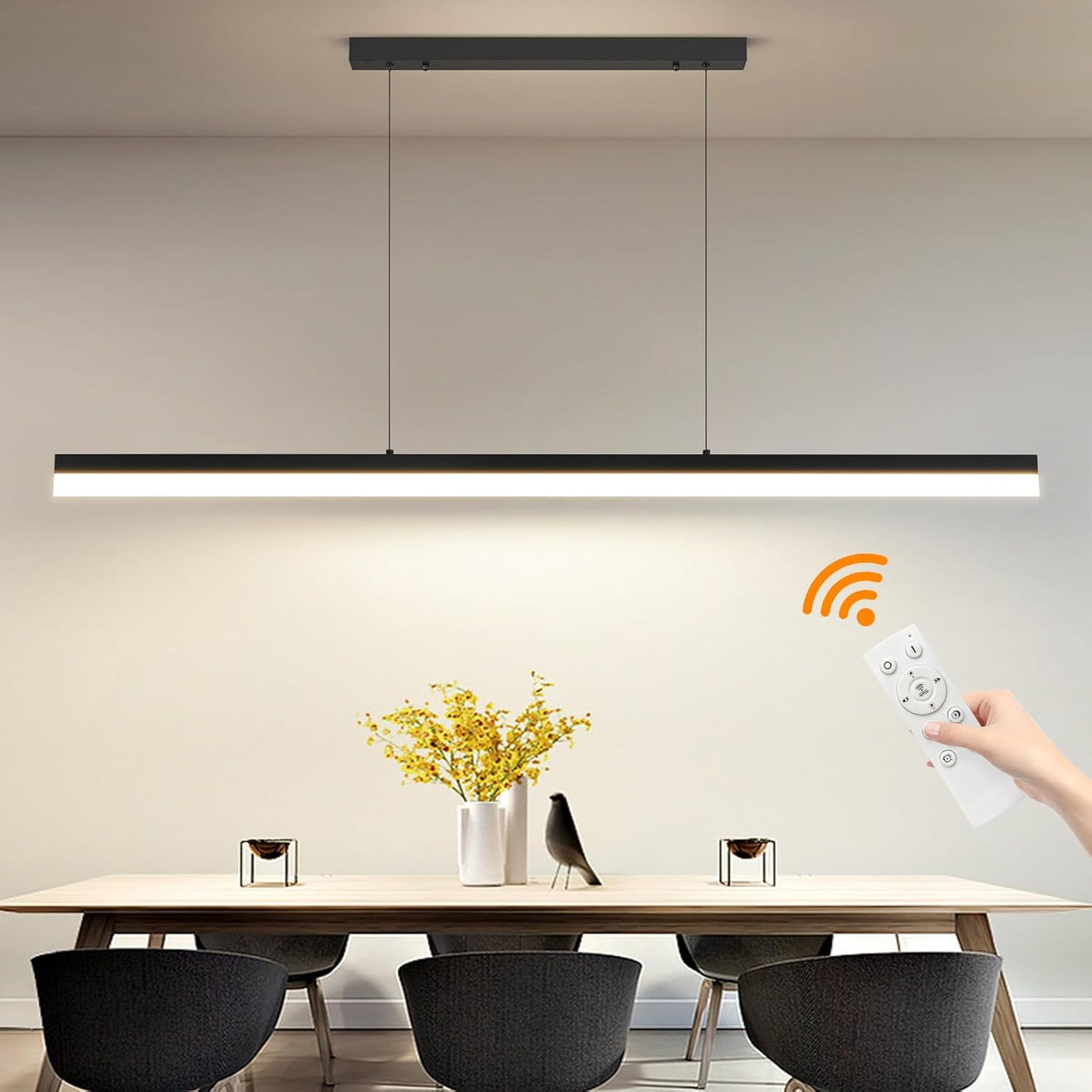 Modern pendant light fixture with remote control in a dining room setting