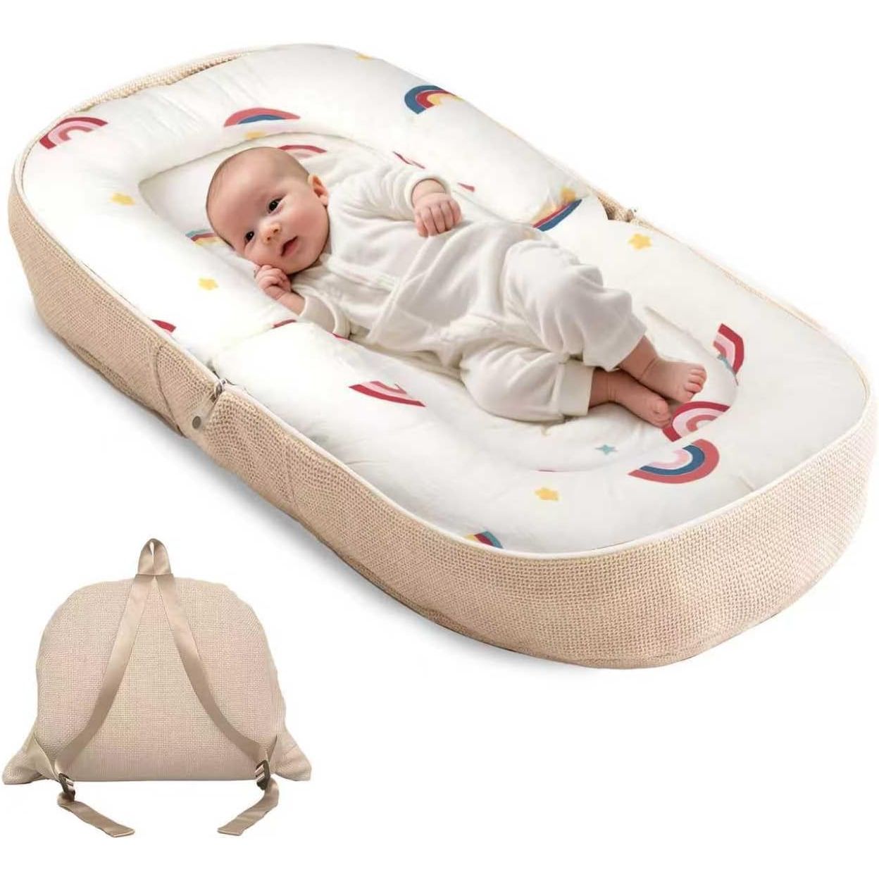 A baby sleep bassinet with a beige woven fabric exterior and a white interior printed with colorful rainbows and stars, shown with a baby lying inside and a smaller inset view of the bassinet folded flat with straps.
