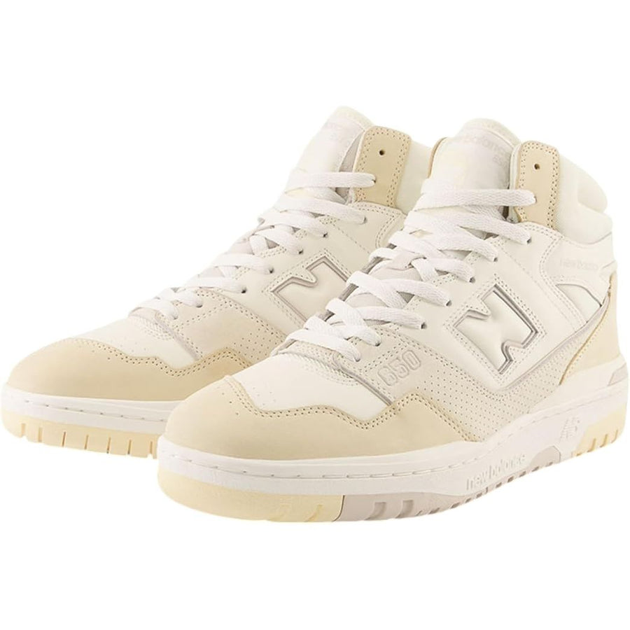 Pair of cream-colored high-top sneakers with white laces on a white background