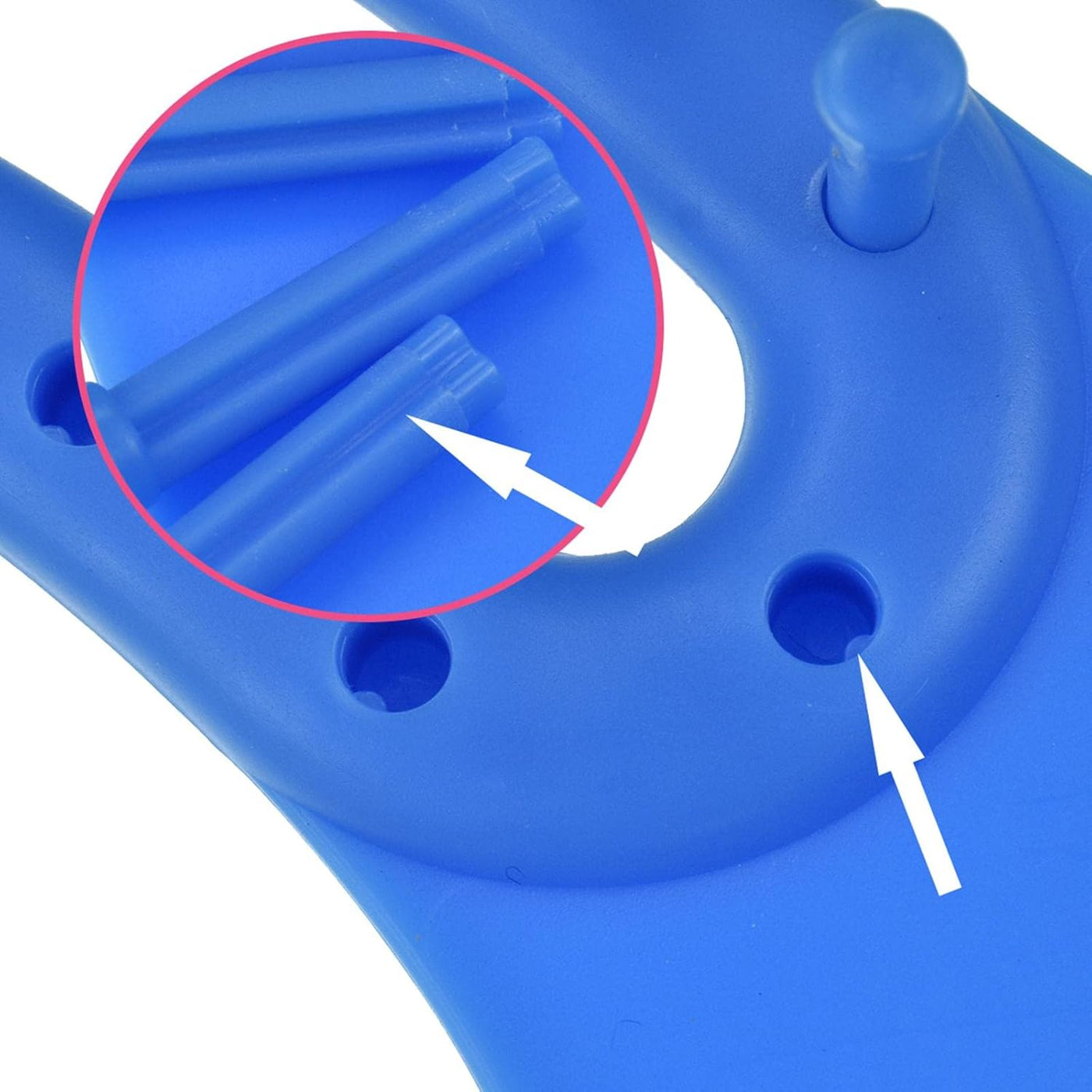 Close-up of a blue plastic component with arrows indicating features