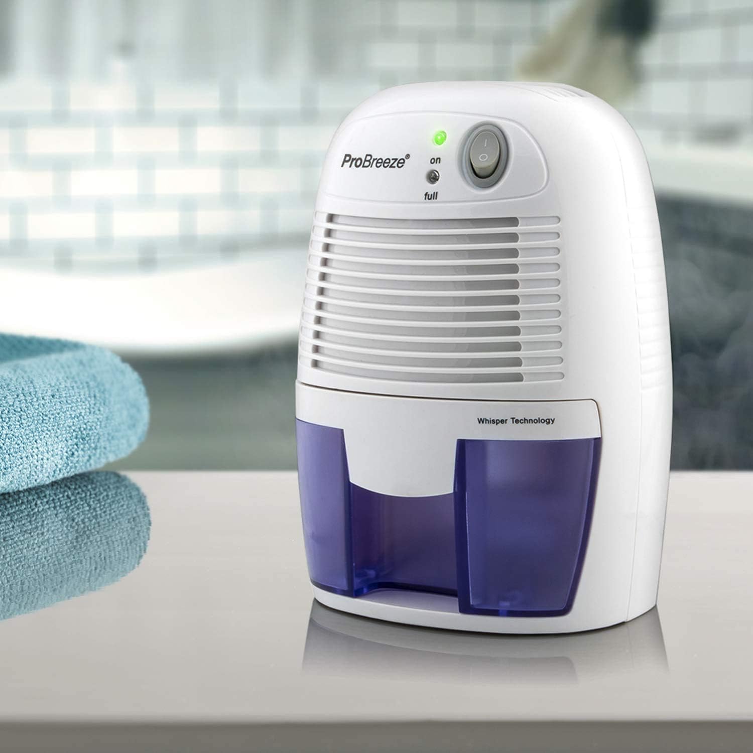ProBreeze dehumidifier on a surface with a blurred background