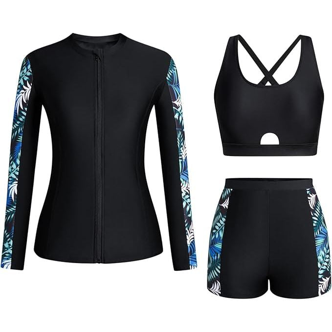 Black athletic outfit with tropical leaf patterns on sleeves and shorts against a white background