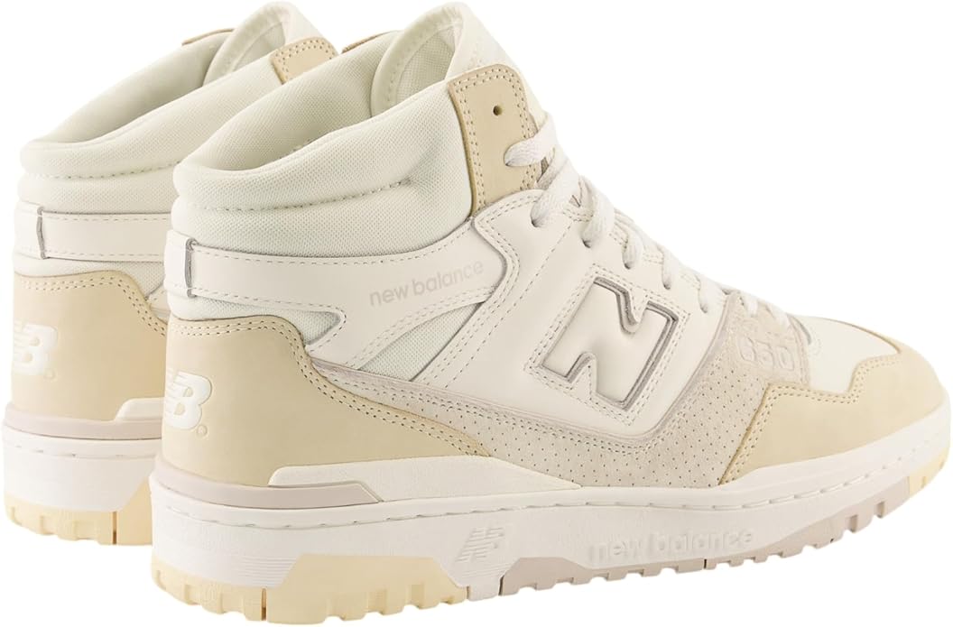 Pair of beige high-top sneakers with New Balance logo on a white background