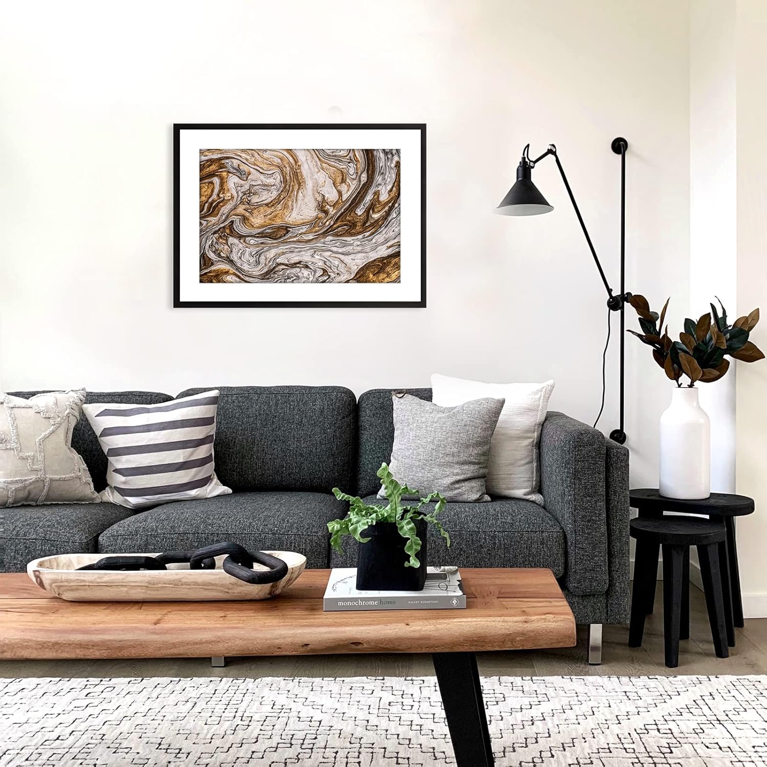 Modern living room with gray sofa, wooden coffee table, and decorative items.