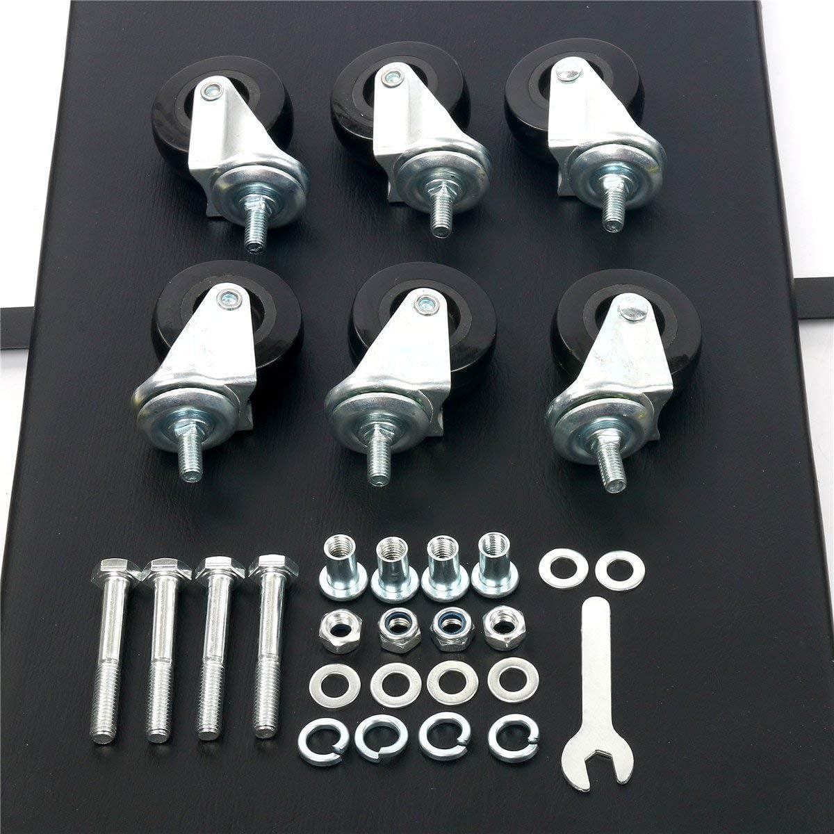 Set of metal brackets with bolts, nuts, and washers on a black background