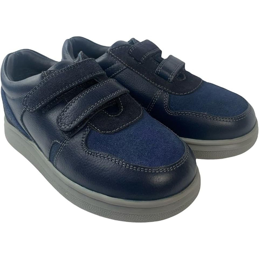 Pair of navy blue children's shoes with velcro straps on a white background