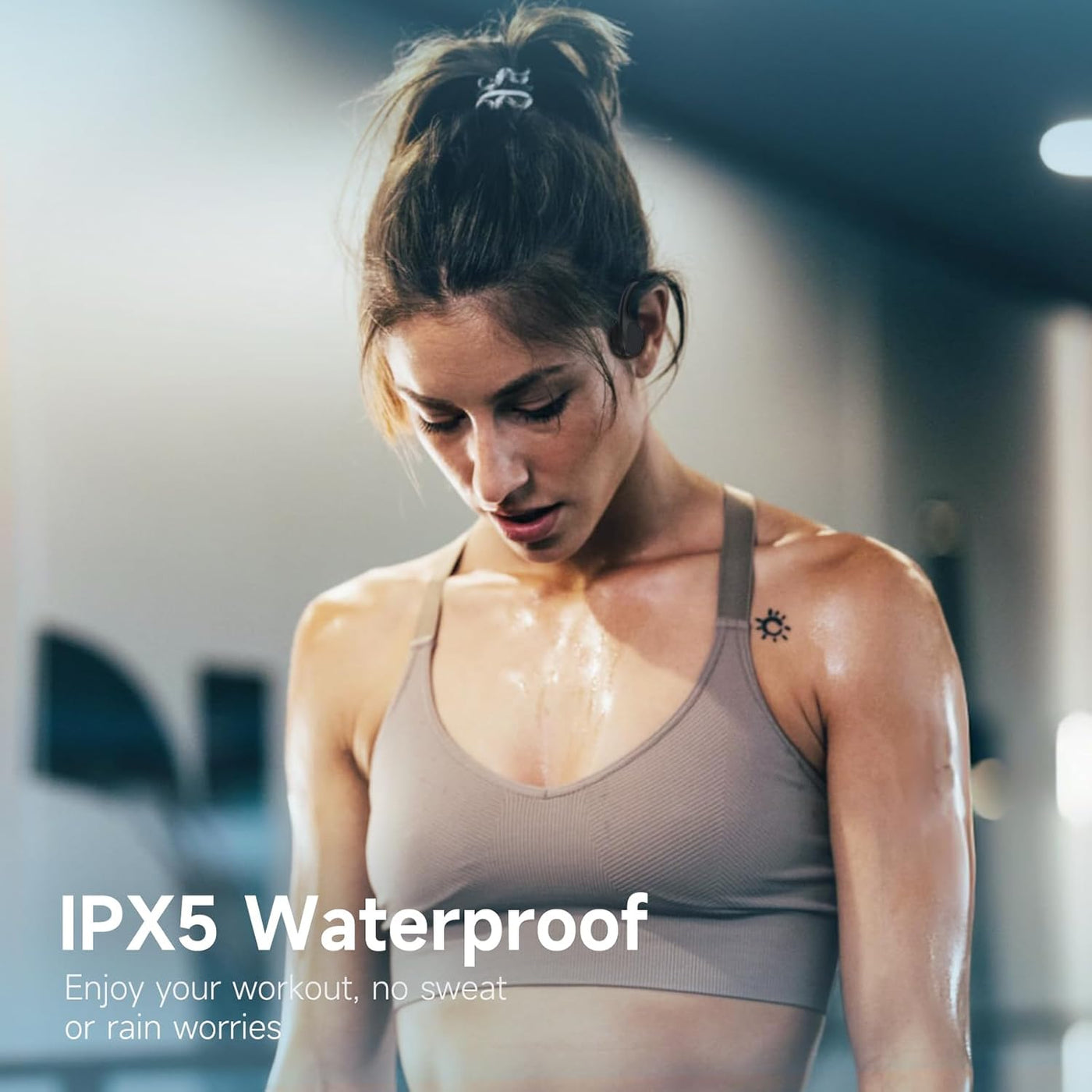 Woman exercising with 'IPX5 Waterproof' text overlay