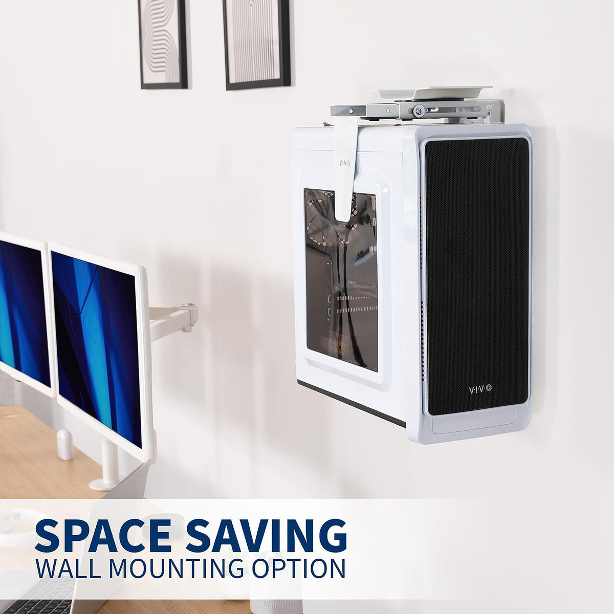 Wall-mounted computer setup with space-saving feature on a white wall.