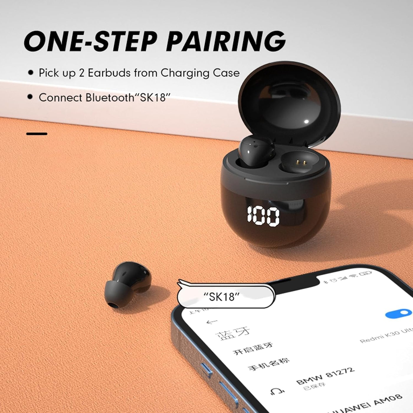 Black wireless earbuds with charging case on an orange surface, connected to a smartphone.