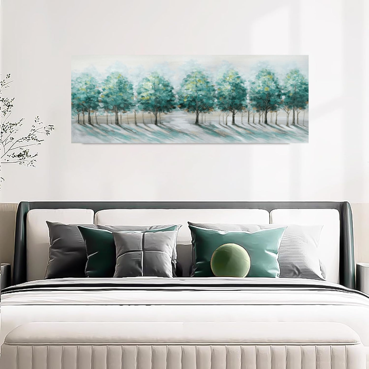 Bedroom with a bed featuring decorative pillows and a large abstract painting of trees on the wall.