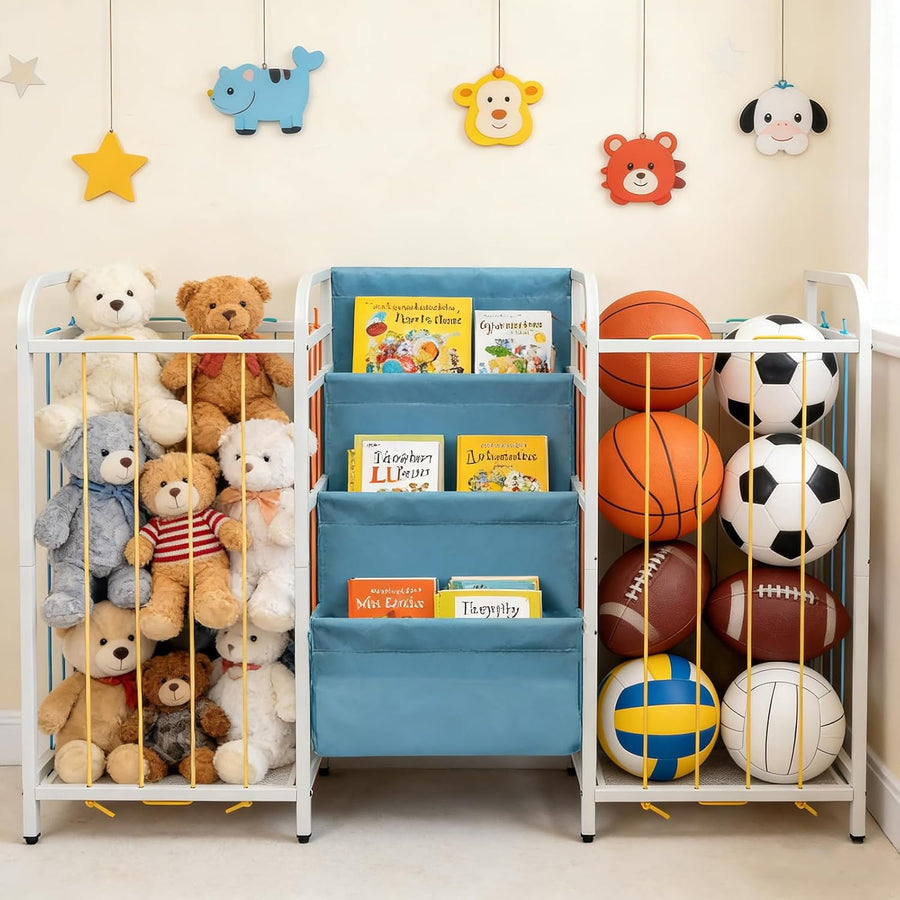 A white metal children's toy and sports storage rack with three blue fabric front pockets holding books, surrounded by stuffed animals and balls on a light beige wall with hanging animal decorations.