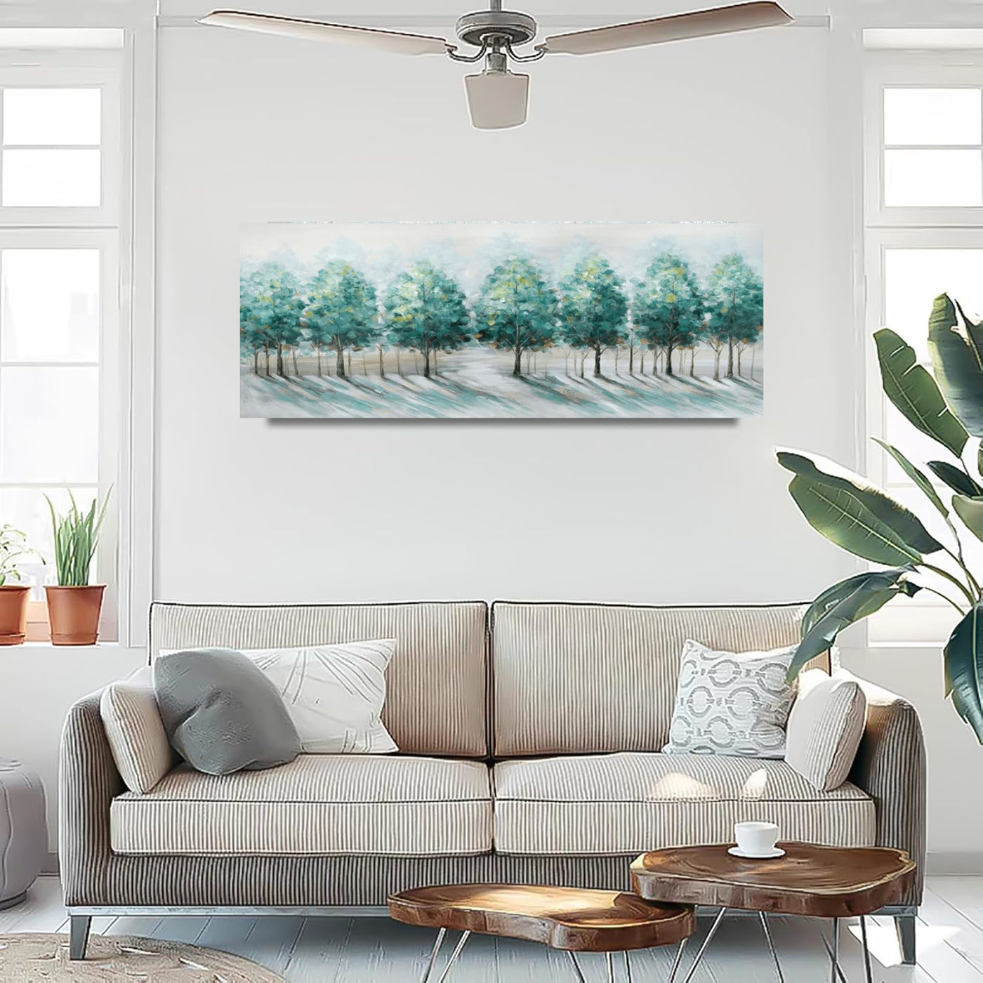 Living room with a beige sofa, wooden coffee table, and a large abstract landscape painting on the wall.