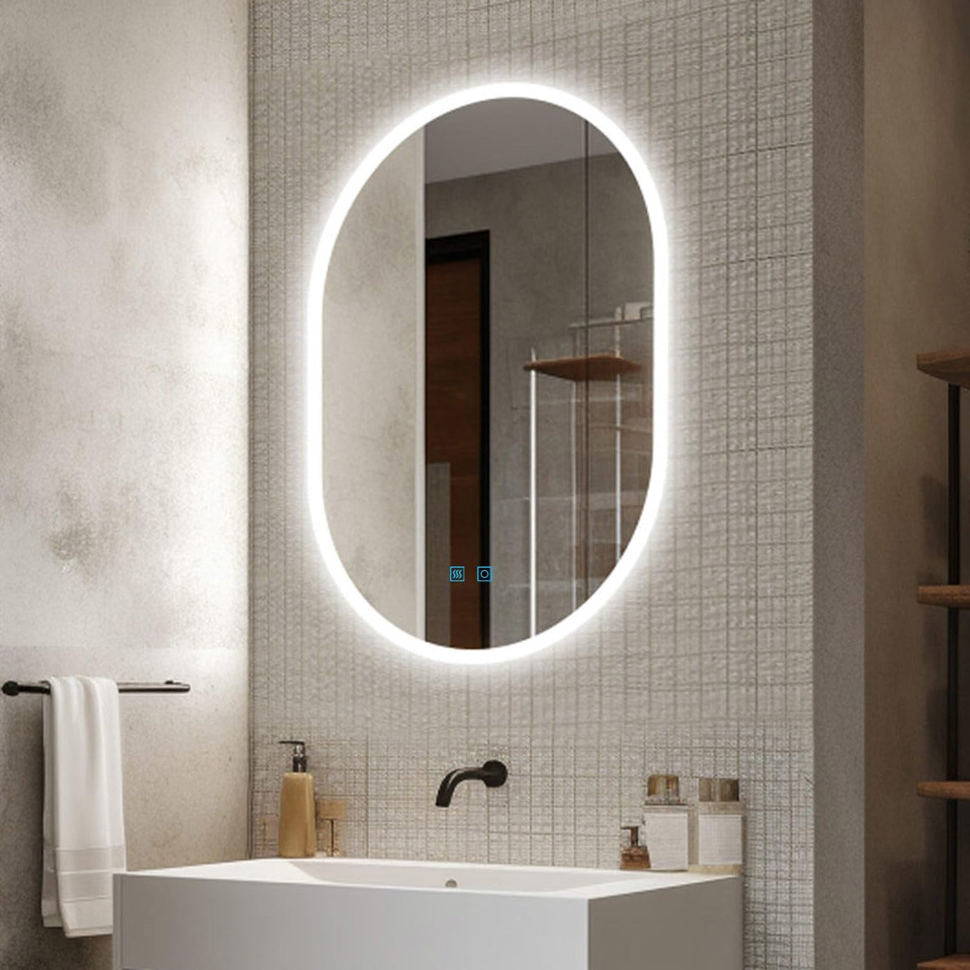 Bathroom with a illuminated oval mirror above a sink.