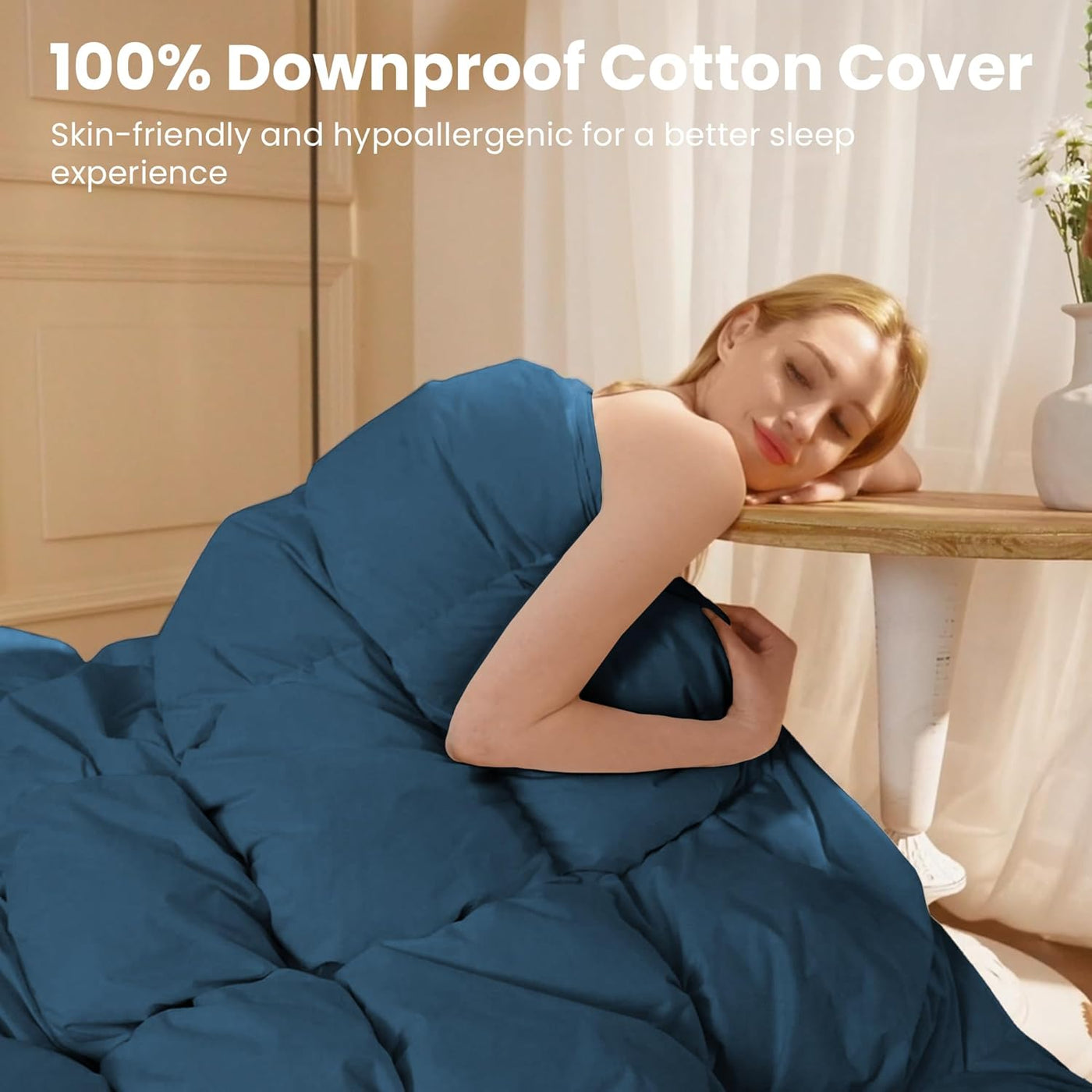 Woman wrapped in a blue 100% downproof cotton cover in a bedroom setting.