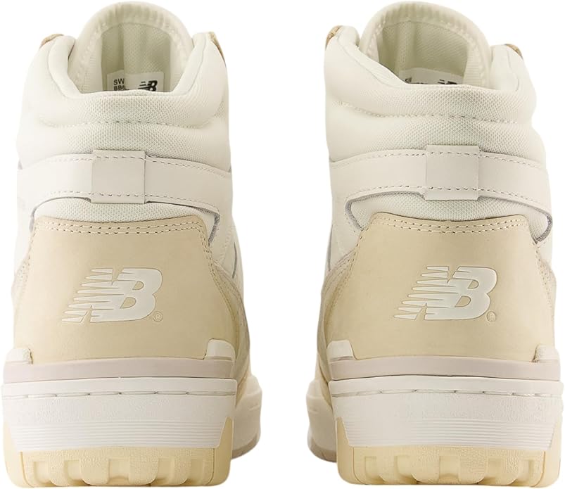 Beige high-top sneakers with New Balance logo on a white background