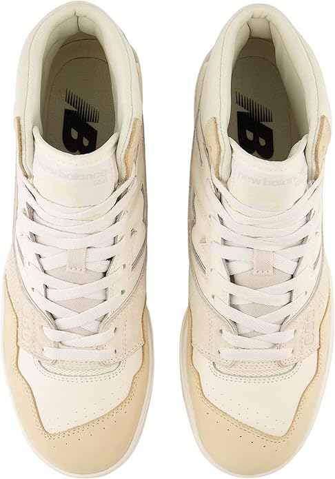Pair of beige high-top sneakers with white laces on a white background