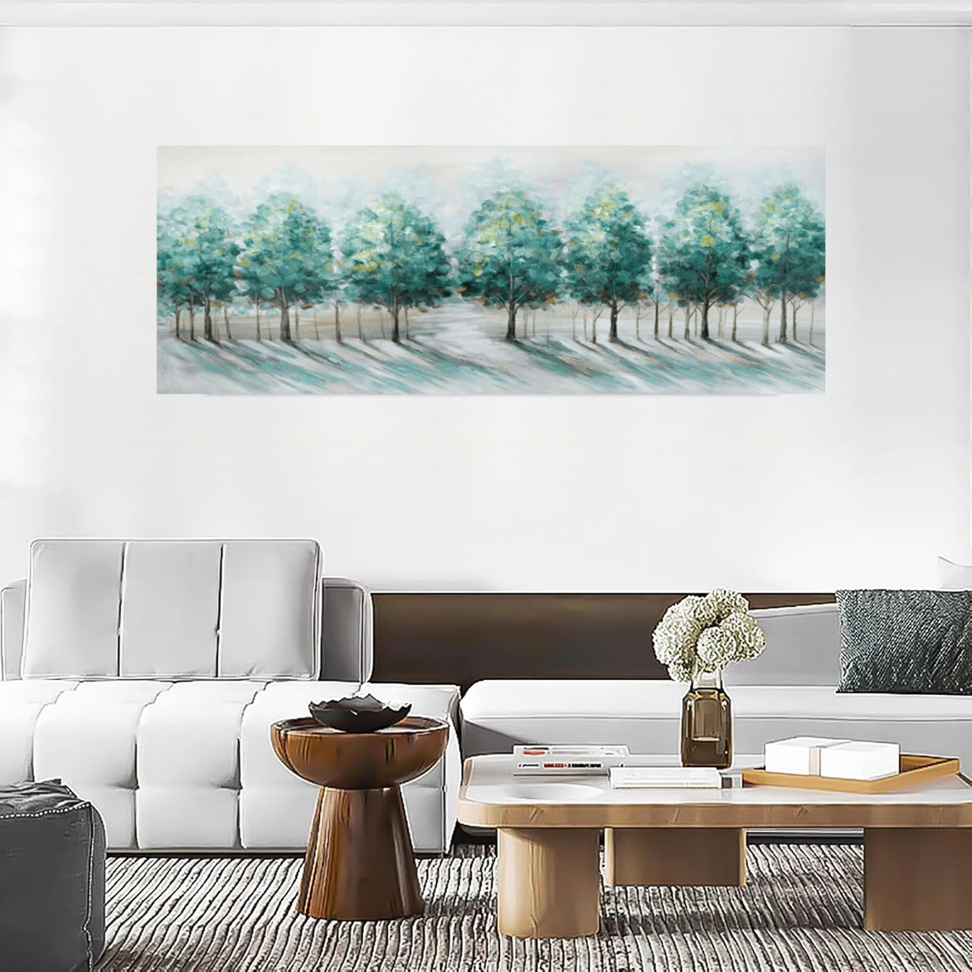 Living room with a large abstract landscape painting on the wall, white sofa, and wooden coffee table.
