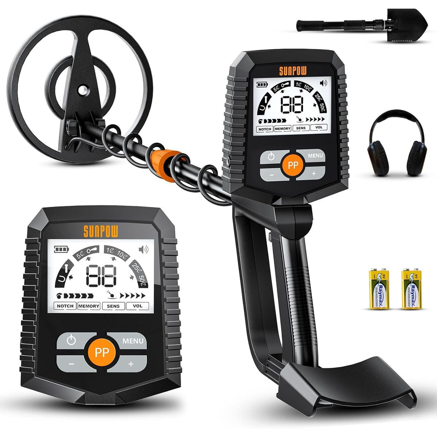 Metal detector with headphones and batteries on a white background