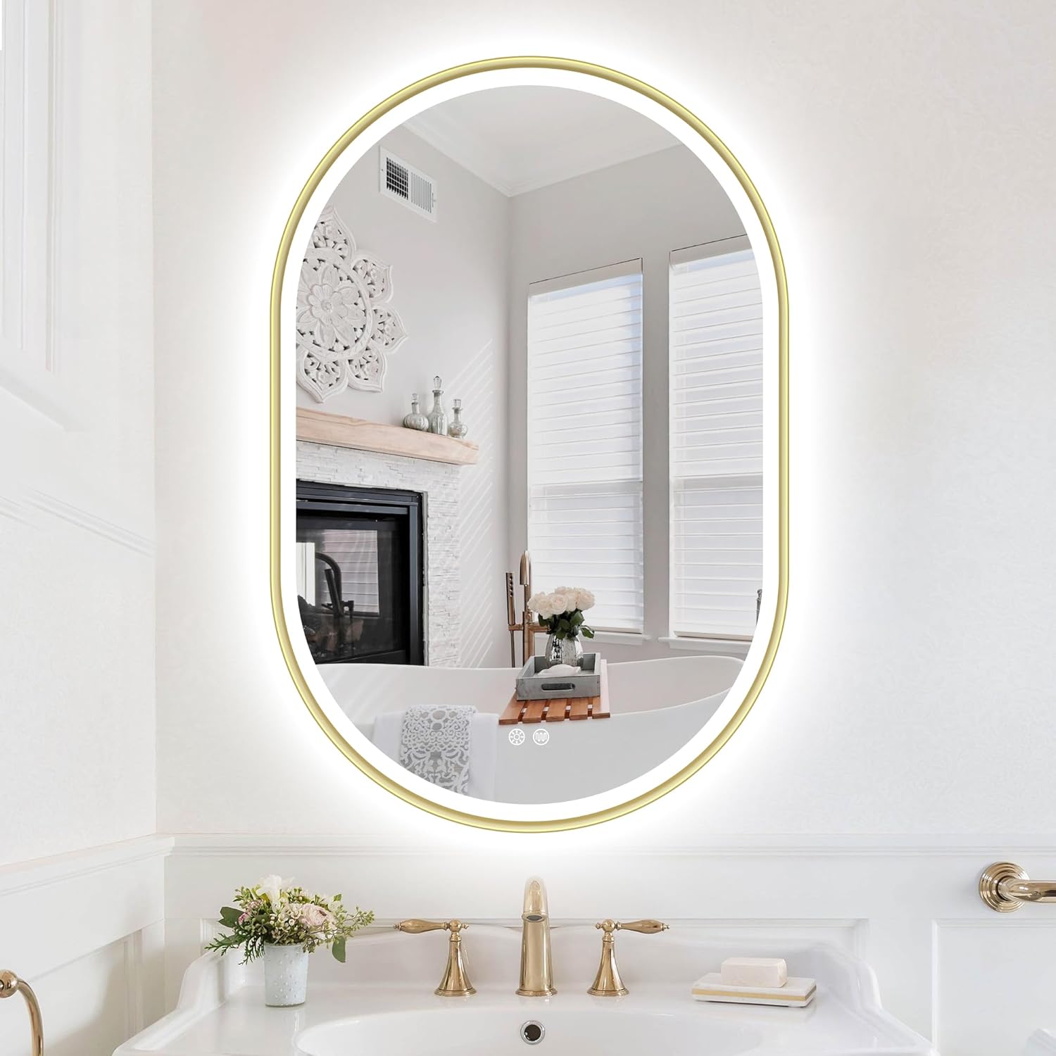 Bathroom with a round mirror with gold frame, sink, and decorative elements.