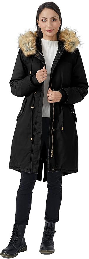 Woman wearing a black coat with fur-lined hood on a white background