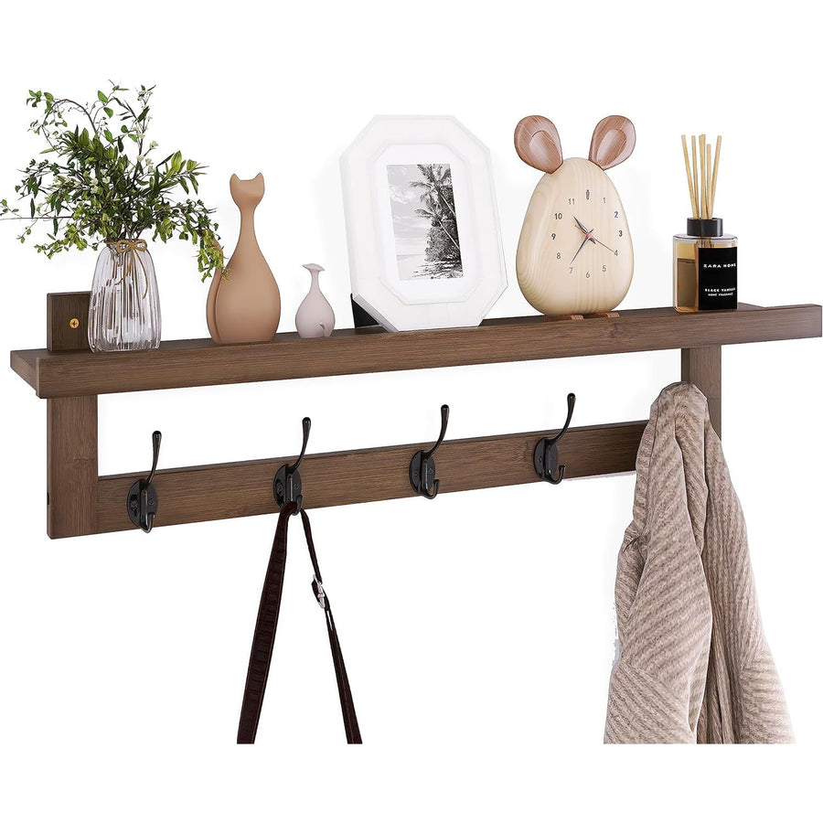 Wooden shelf with decorative items and hooks on a white background