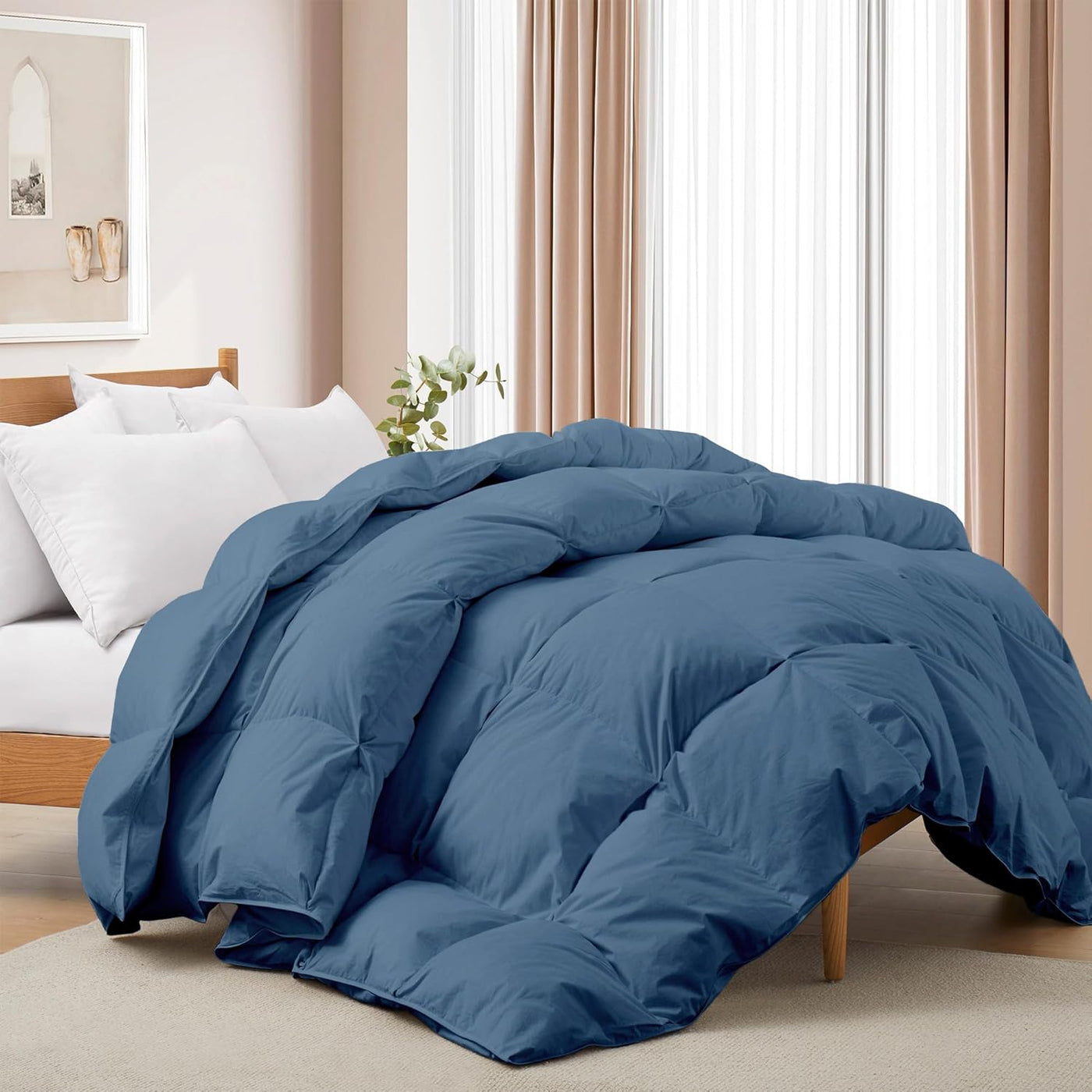 Blue comforter on a bed in a bedroom setting