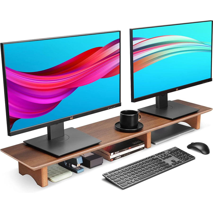 Two computer monitors on a wooden desk with keyboard, mouse, and other accessories.