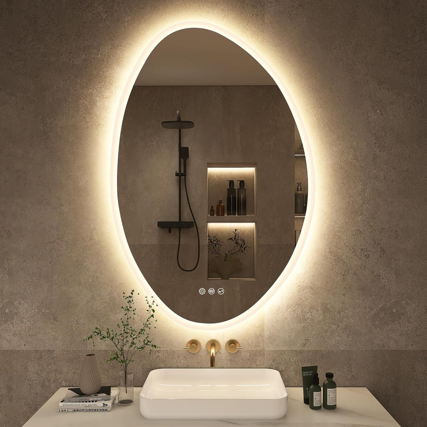 Bathroom with a large oval mirror with lighting, sink, and toiletries.
