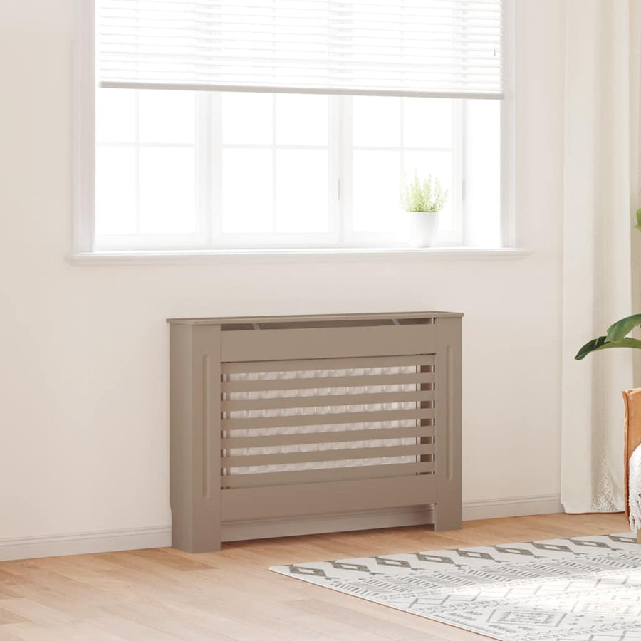 Gray radiator in a room with a window and light-colored walls