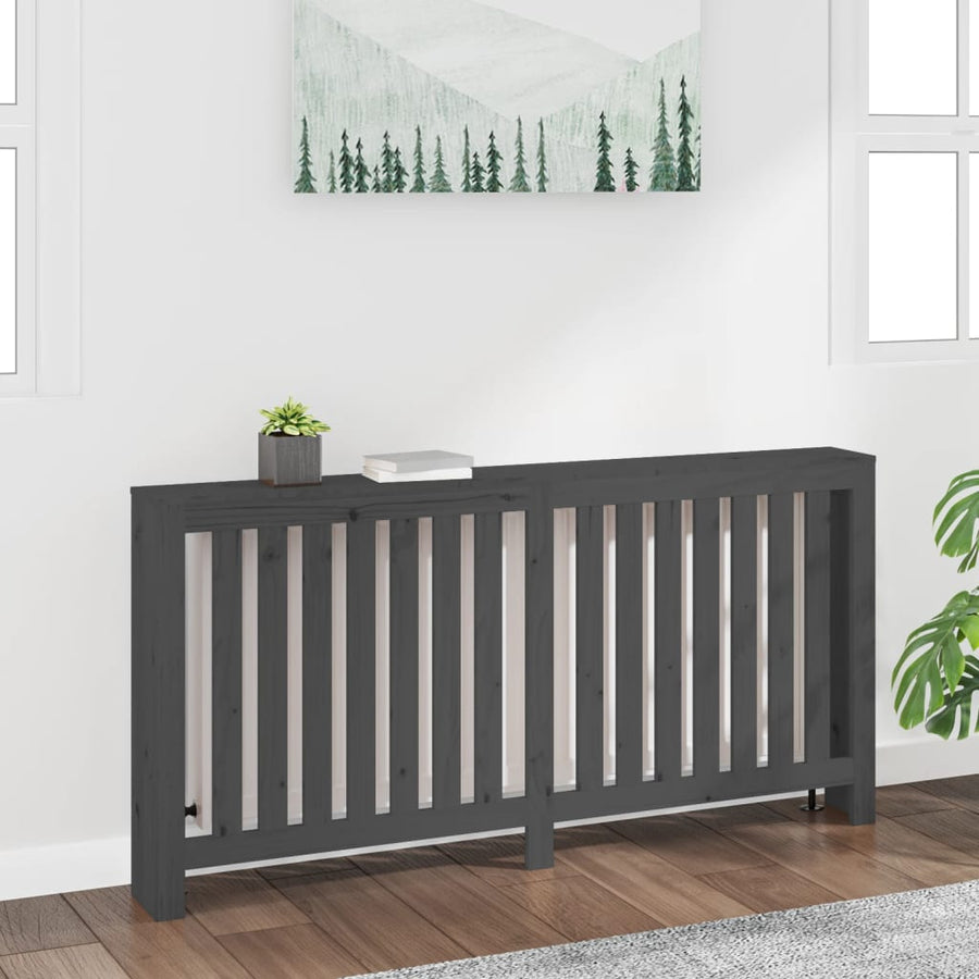 Dark wooden radiator cover against a white wall with decorative elements.