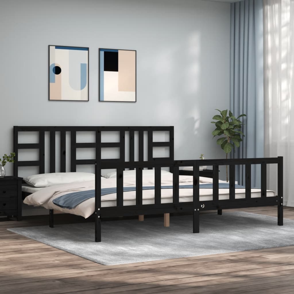 Black metal bed frame in a room with abstract art on the wall and a plant.