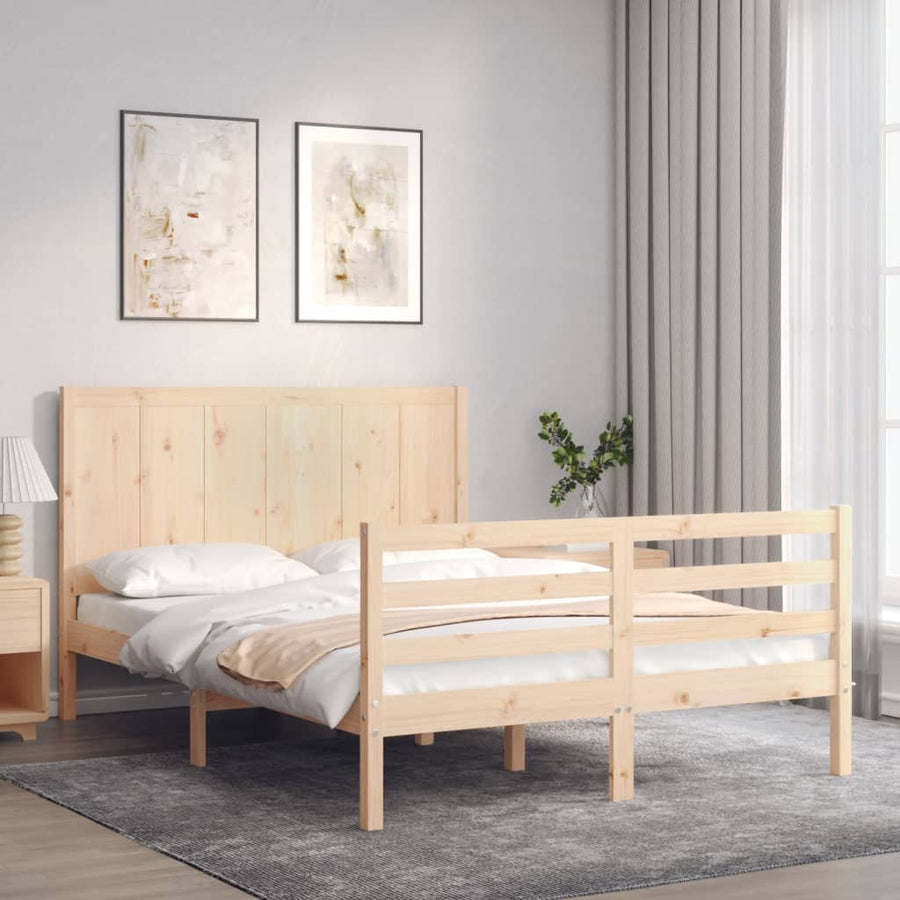 Wooden bed in a room with light gray walls and a lamp.