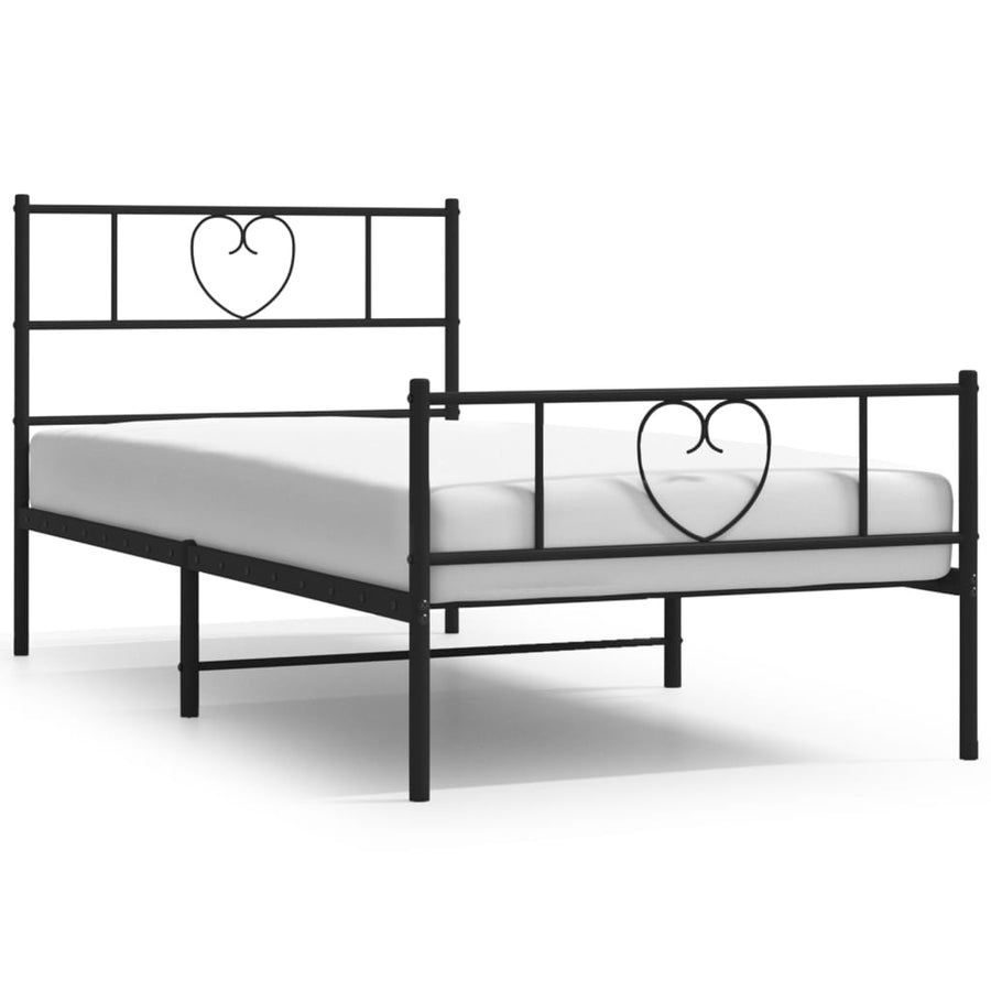 Black metal bed frame with heart designs on a white background