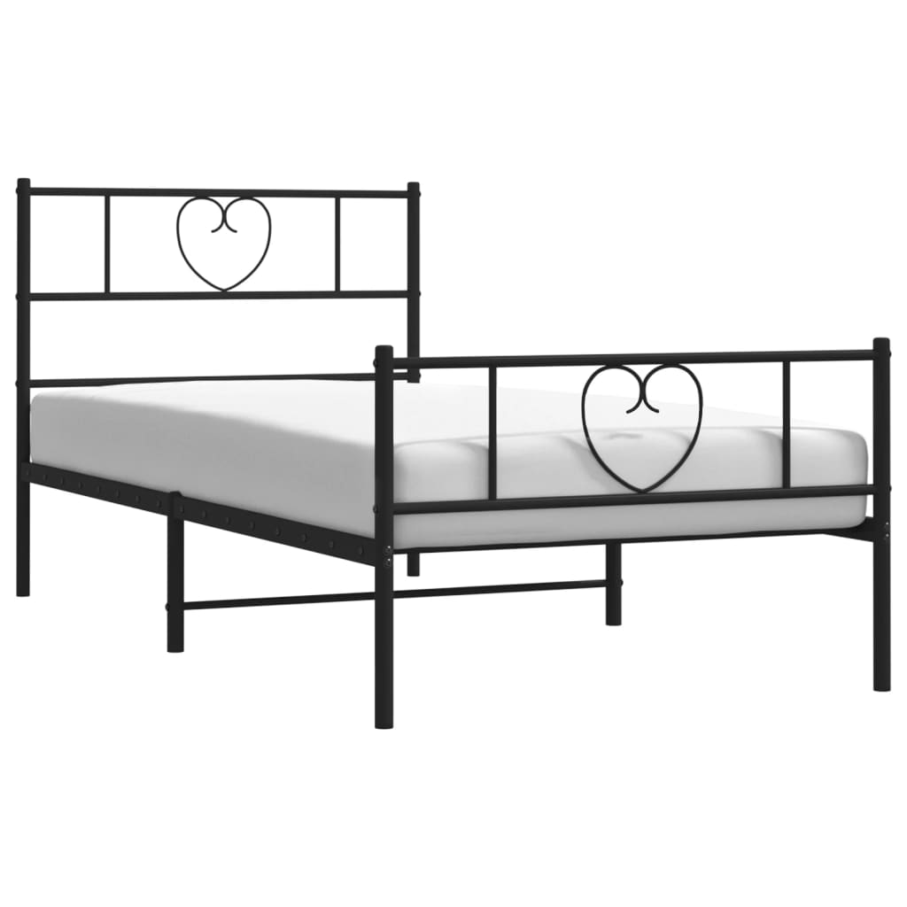 Black metal bed frame with heart designs on a white background