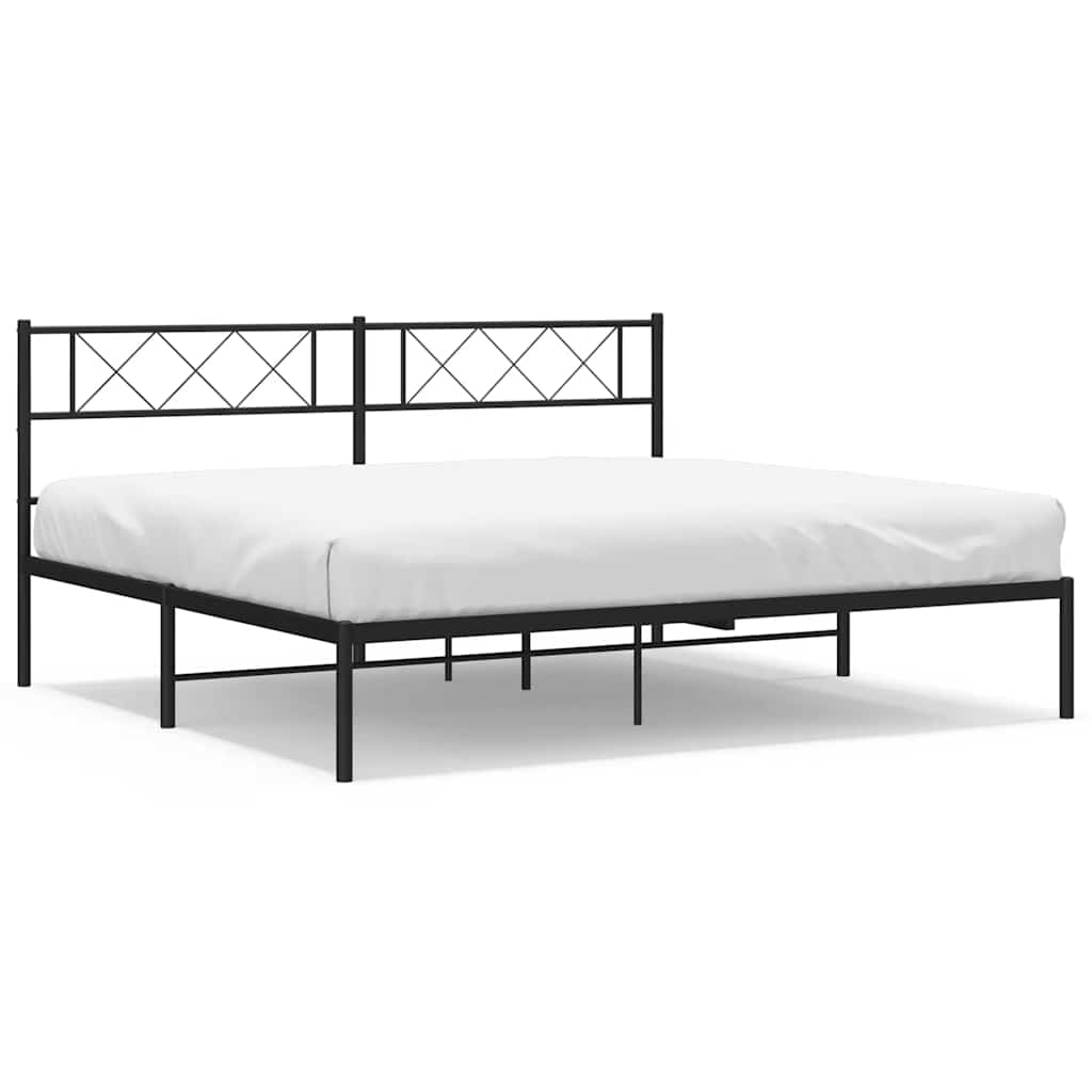 Black metal bed frame with white mattress on a white background