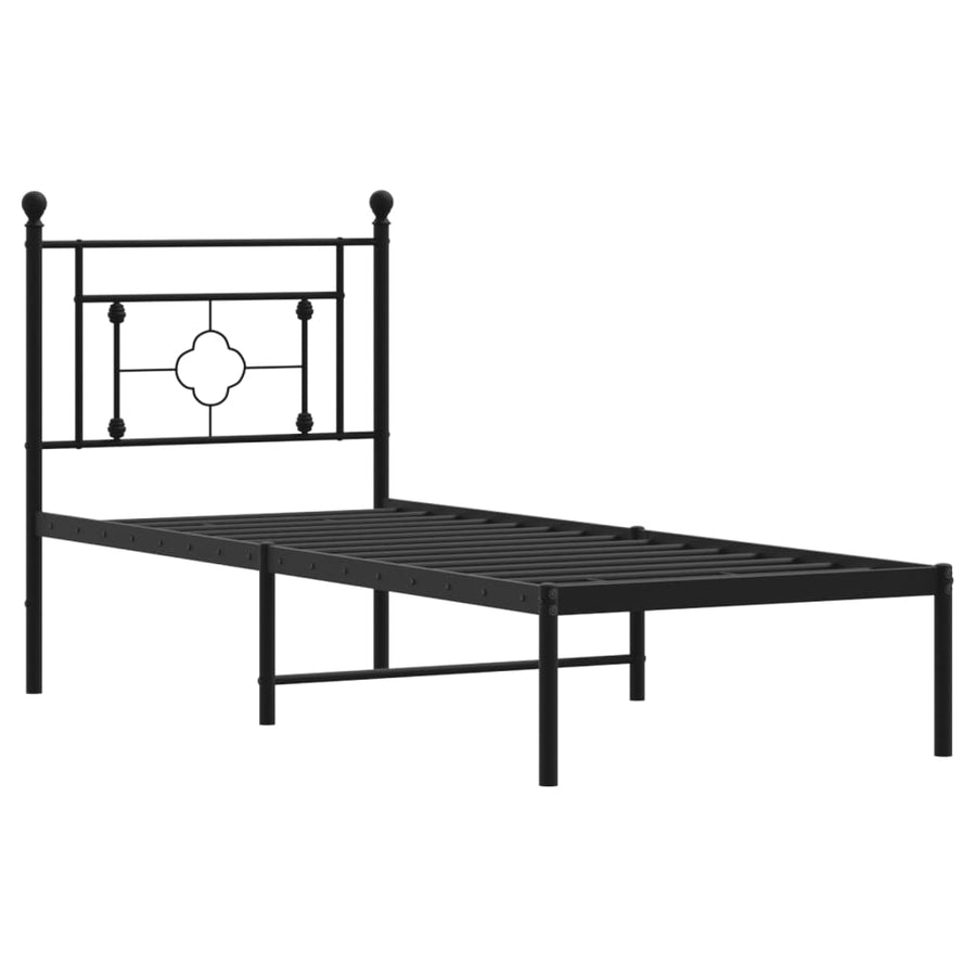 Black metal bed frame with decorative headboard on a white background