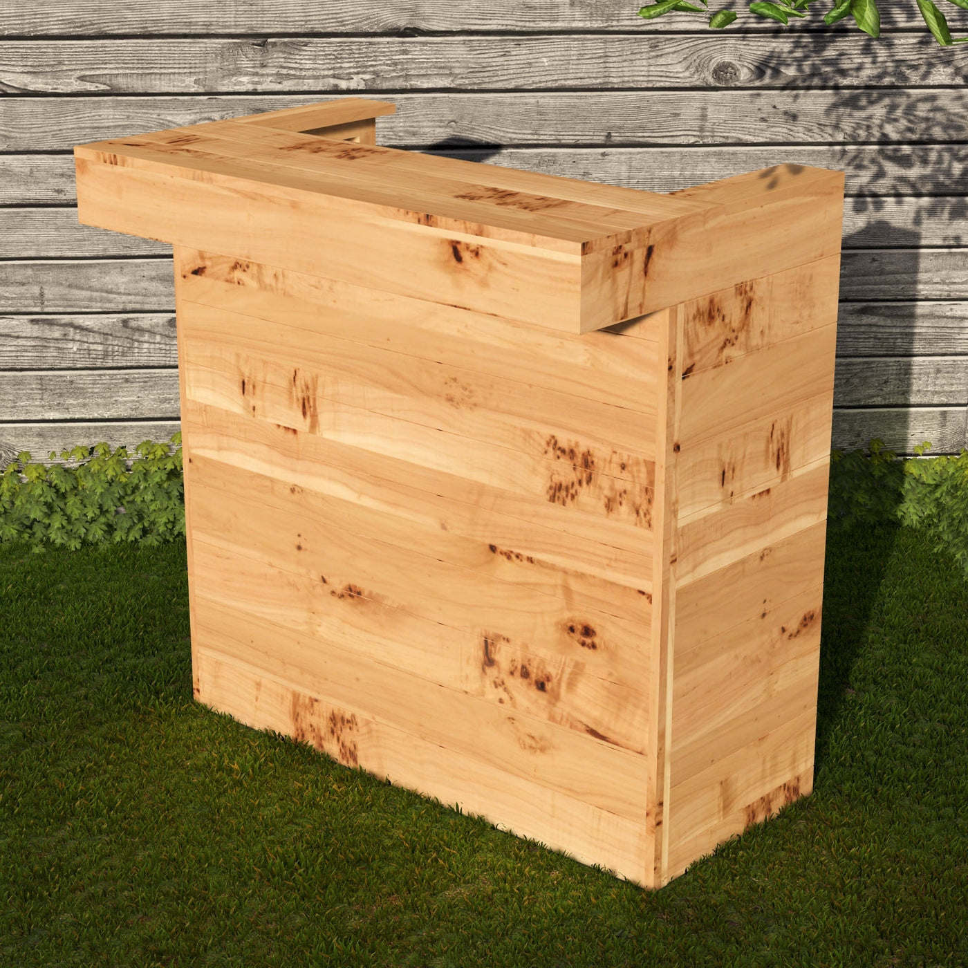 Wooden outdoor bar against a wooden wall with grass below
