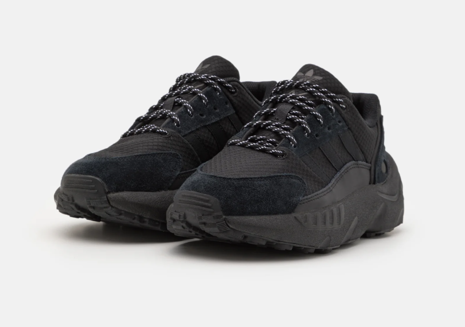 Pair of black sneakers on a white background