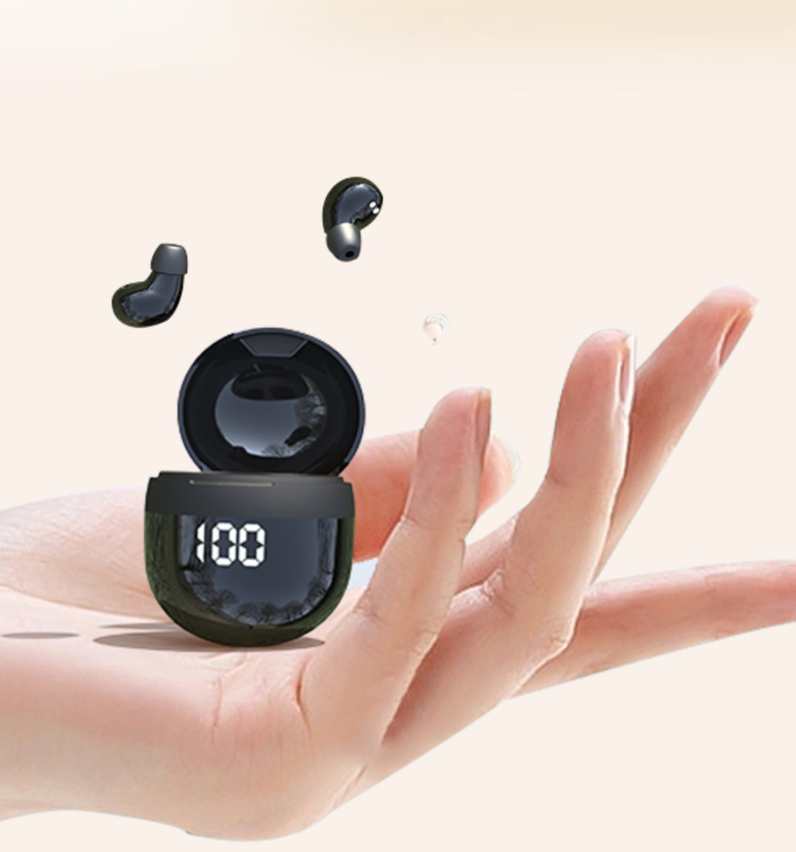 Black wireless earbuds with charging case held in a hand on a light background