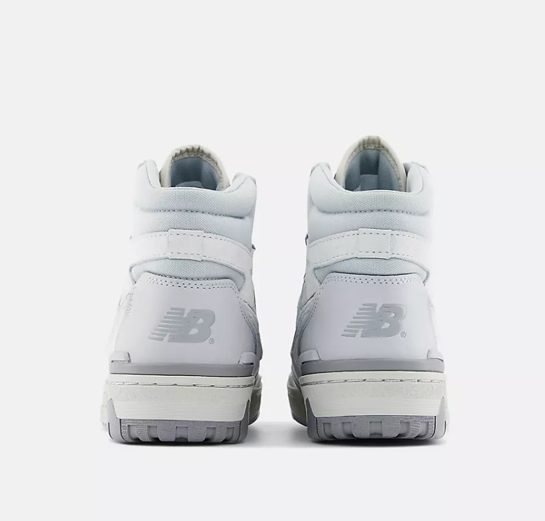 White high-top sneakers with New Balance logo on a white background