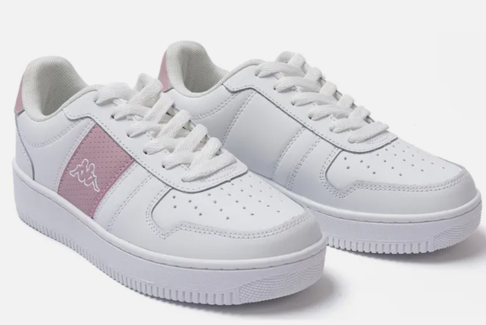 White sneakers with a pink patch on a white background