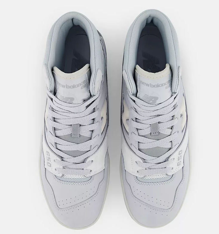 Pair of gray sneakers with New Balance logo on a white background