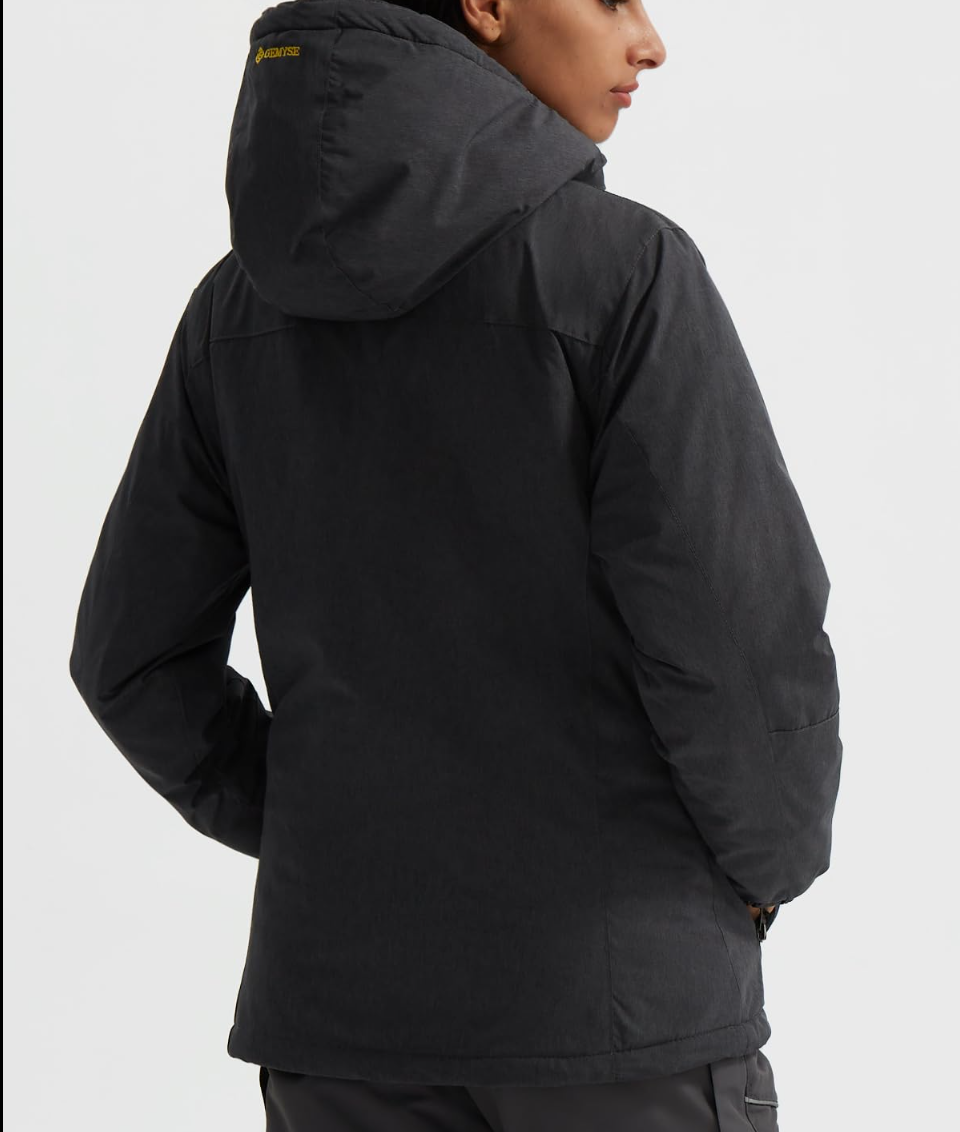 Person wearing a black jacket on a white background