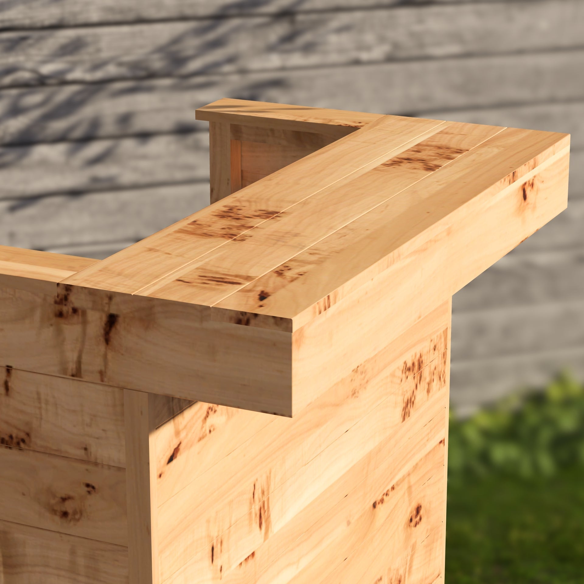 Wooden bench with a rustic finish against a wooden wall.