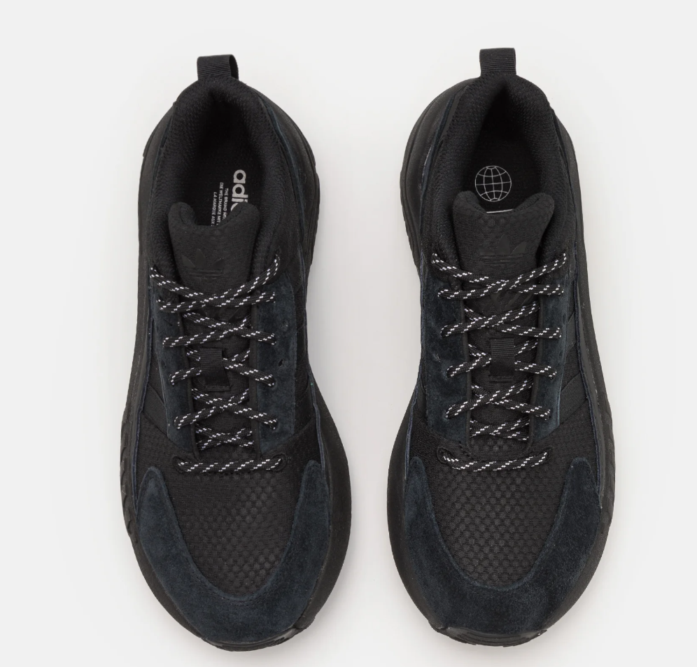 Black Adidas sneakers on a white background