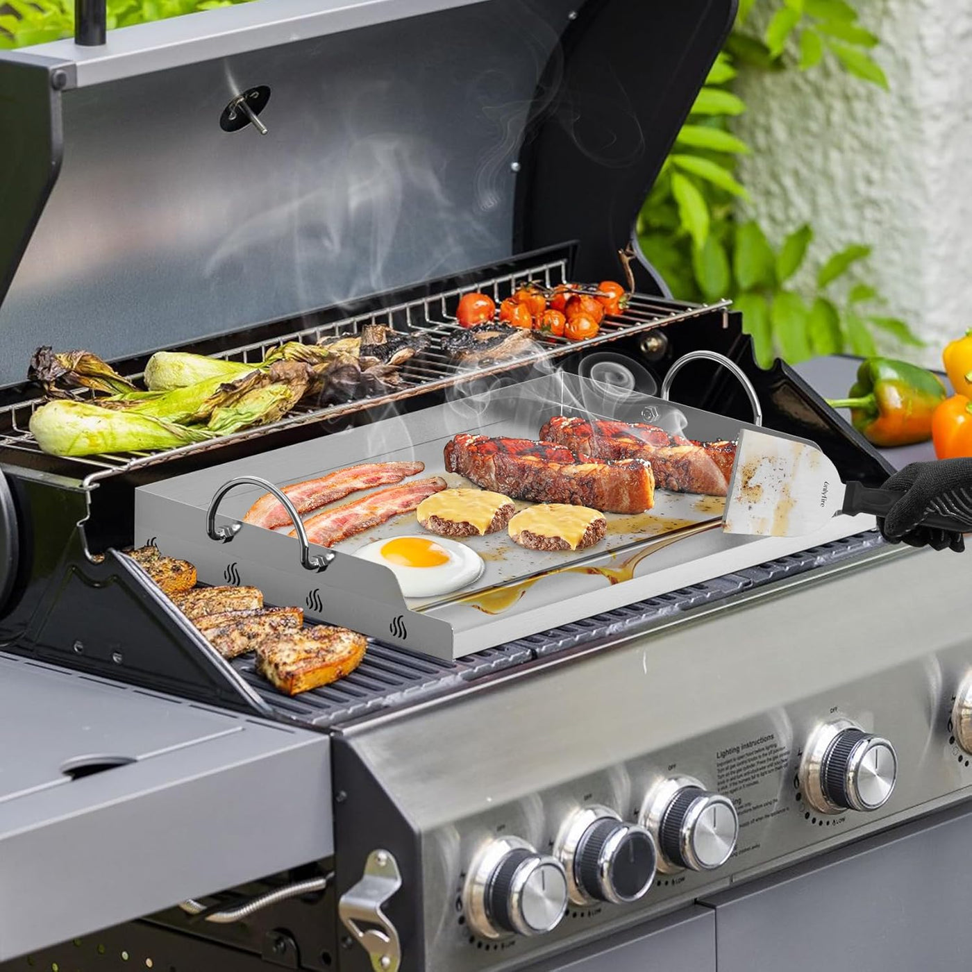 Grill with various foods cooking on different grates outdoors