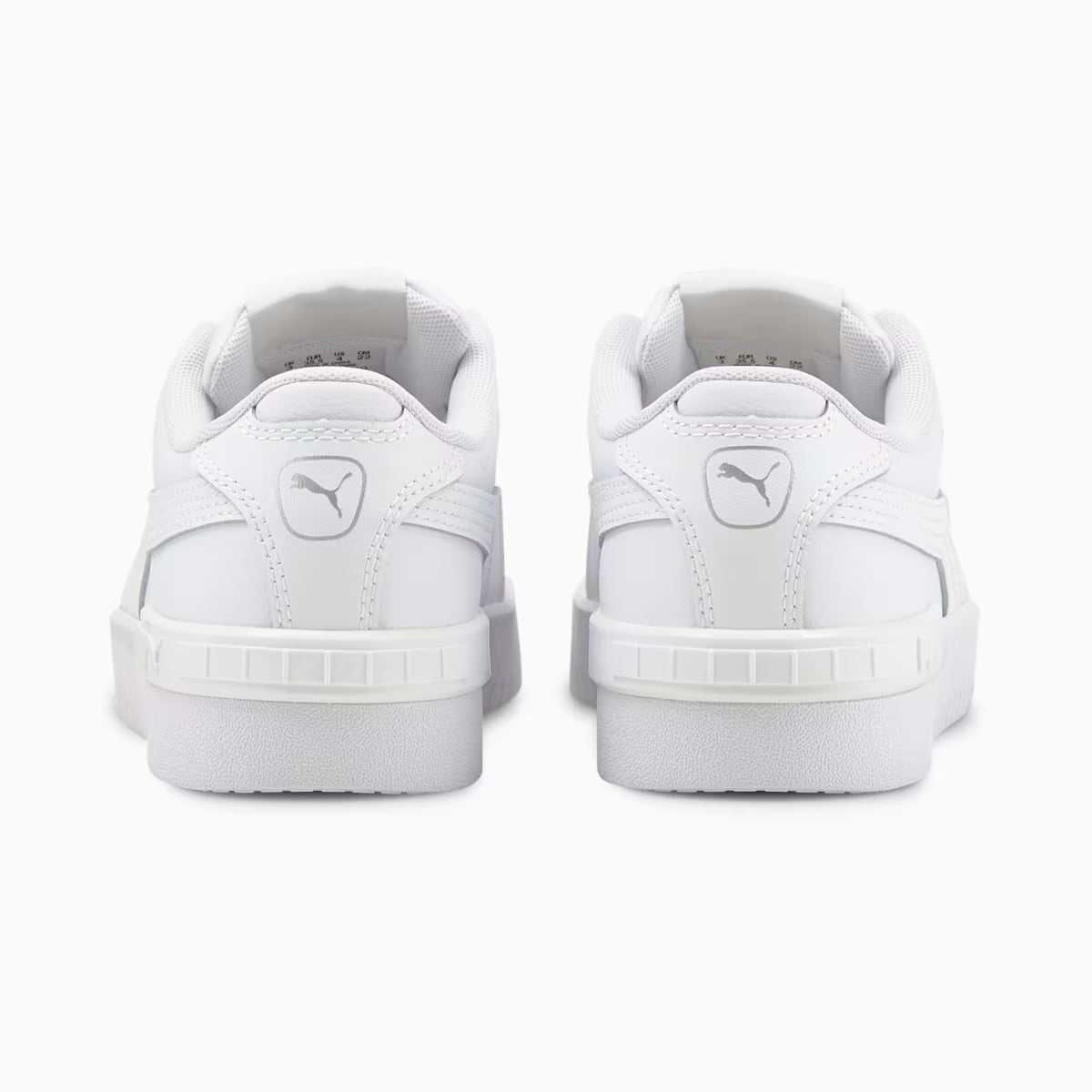 White sneakers with Puma logo on a white background