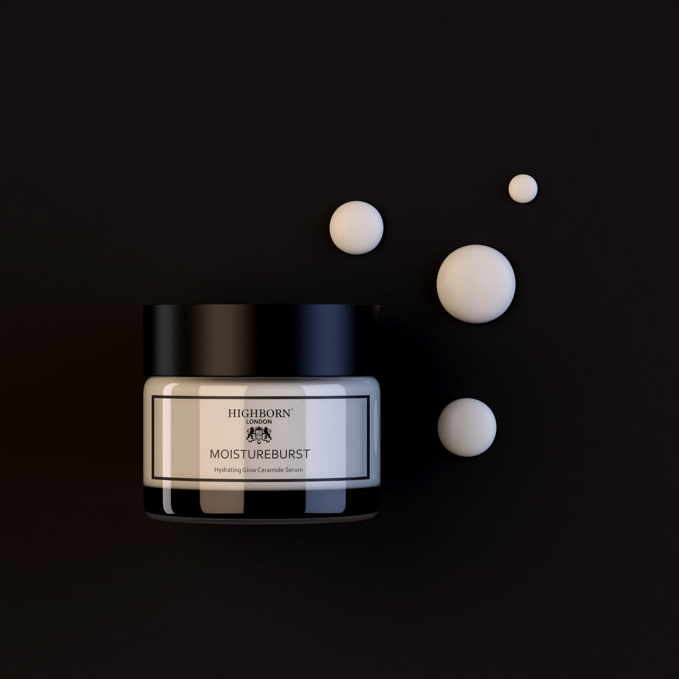 Highborn Moistureburst cream jar with cream balls on a black background