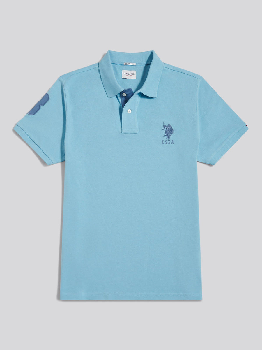 Light blue polo shirt with a small logo on a light gray background